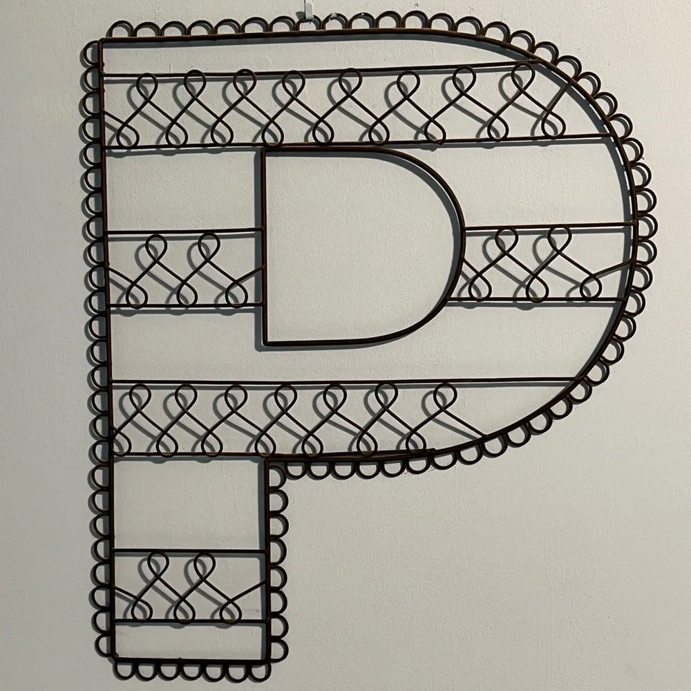 “P” metal wall hanging.